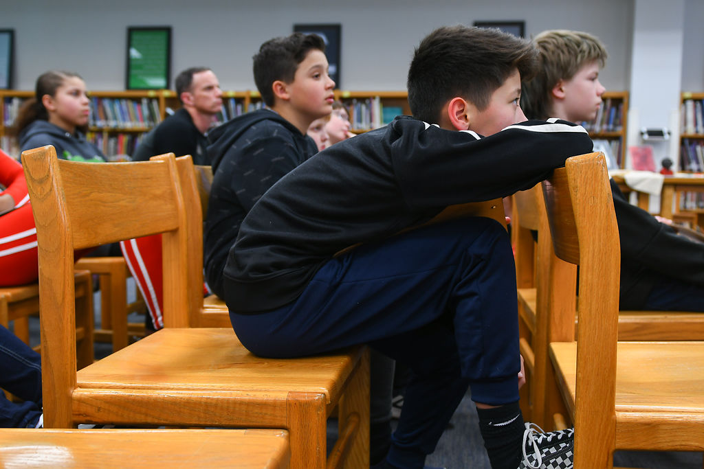Derek Roni and his class listen to Khaliad el-Hakim